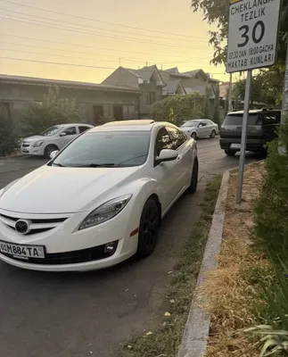 Mazda 6 amerikalik, dvigateli 3,7 l, 277 ot kuchi. Oq rang. Old yuritma. 1