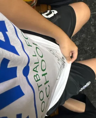 FIFA prezidenti Infantinoning avtografi va yonida Ravshan Irmatovning avtografi