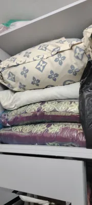Перьевые подушки и большие одеяла