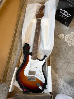 VOX kombo kuchaytirgichi bilan Cort elektro gitarasi 8