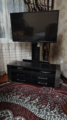 Телевизор Artel диагональю 43 дюйма с тумбой — 3 миллиона 1
