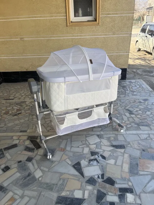 Elektroniy bolalar krovati