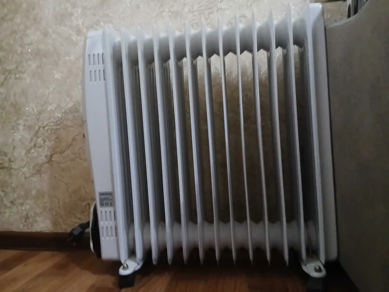Напольный масляный обогреватель