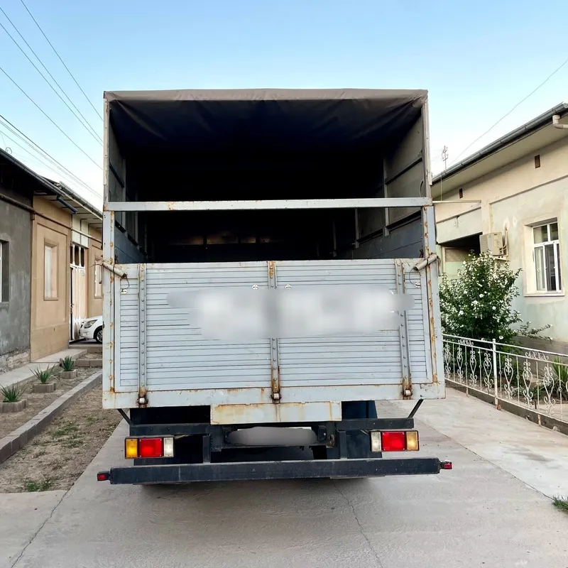 ISUZU Бортовой с тентом — фото 4