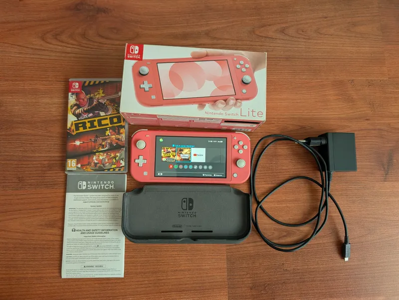 Nintendo switch lite цвет коралловый 1