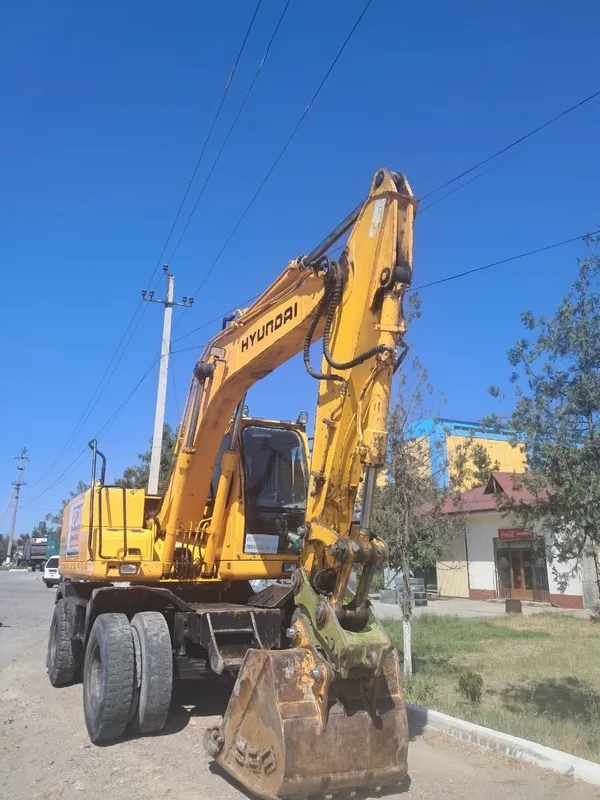 Hyundai Robex 1400W-7 g‘ildirakli ekskavatori. 1 Hyundai Robex 1400W-7 g‘ildirakli ekskavatori. 1