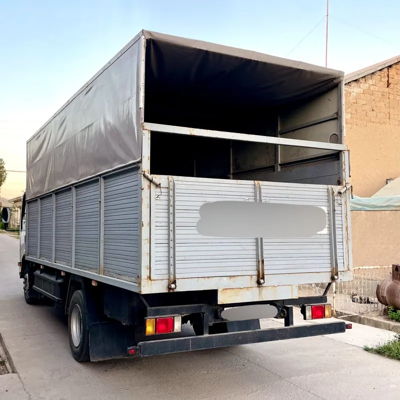 ISUZU Бортовой с тентом — фото 1