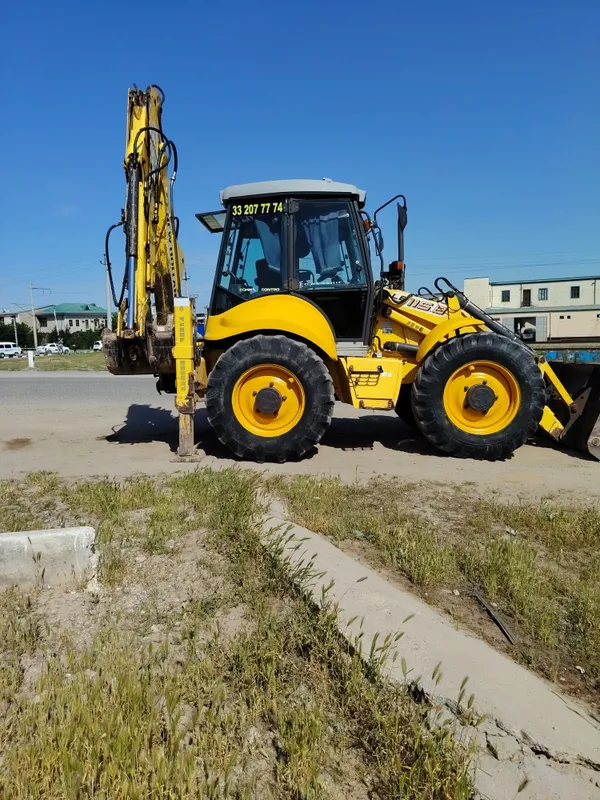 New Holland 115 Pagruzchik 4 New Holland 115 Pagruzchik 4