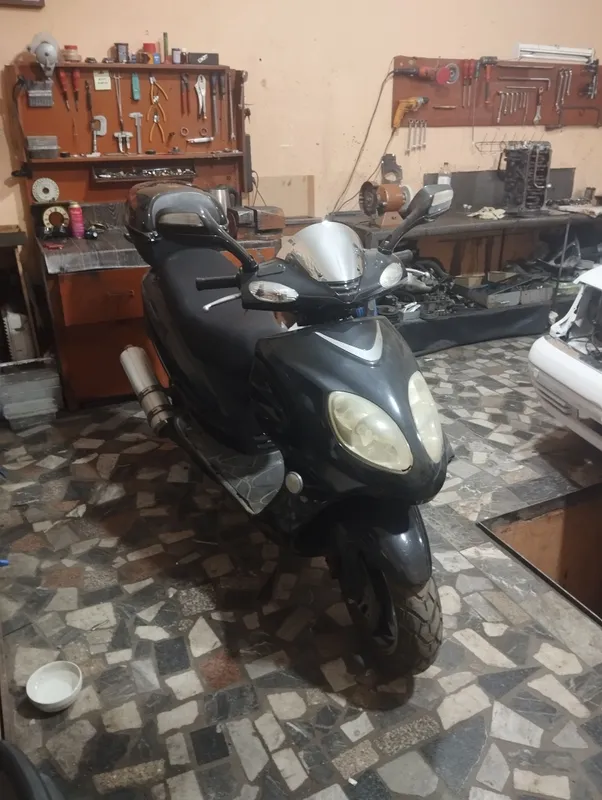 скутер Kawasaki
