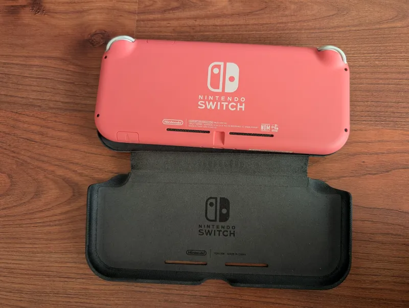 Nintendo switch lite цвет коралловый 2