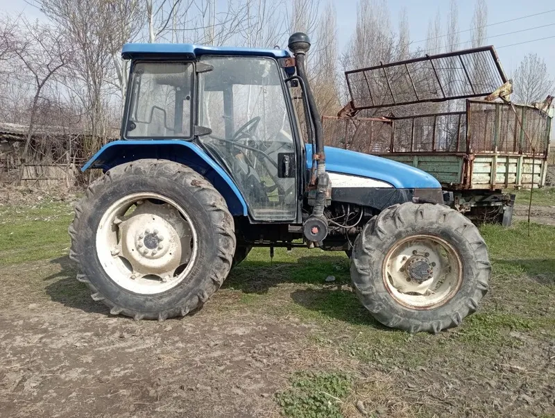 New Holland ТЛ100 — фото 1