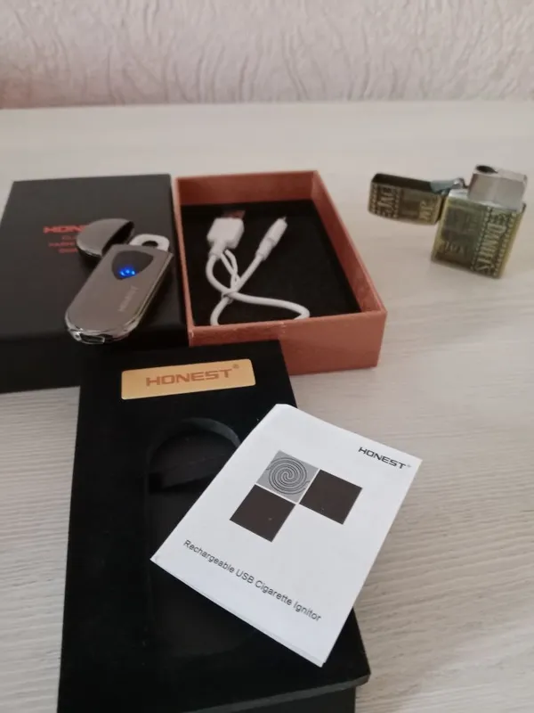 Продам оригинальную зажигалку Honest с электронной зарядкой в отличном — фото 2