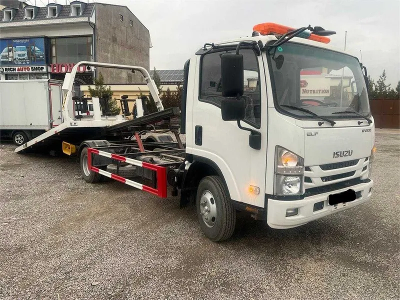 ISUZU ELF KV100 Эвакуатор — фото 1