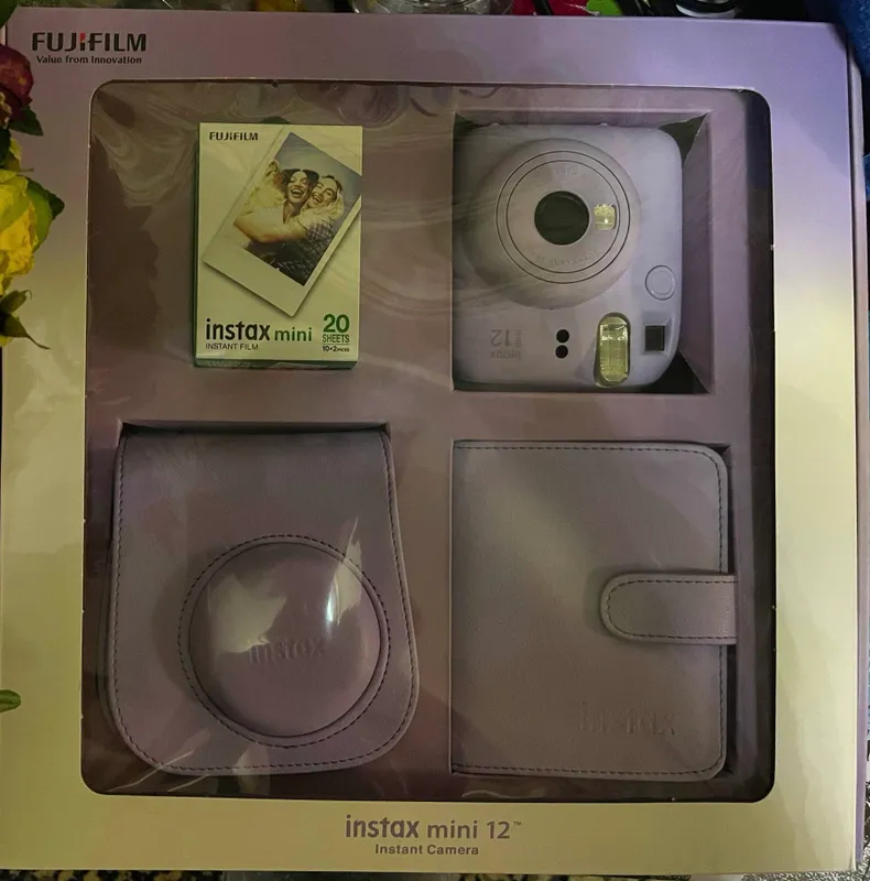 Instax mini 12. Фотографирует и сразу распечатывает. 1 Instax mini 12. Фотографирует и сразу распечатывает. 1