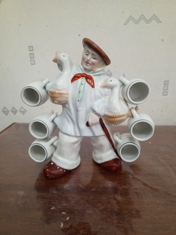 Статуэтка мужчины с гусями