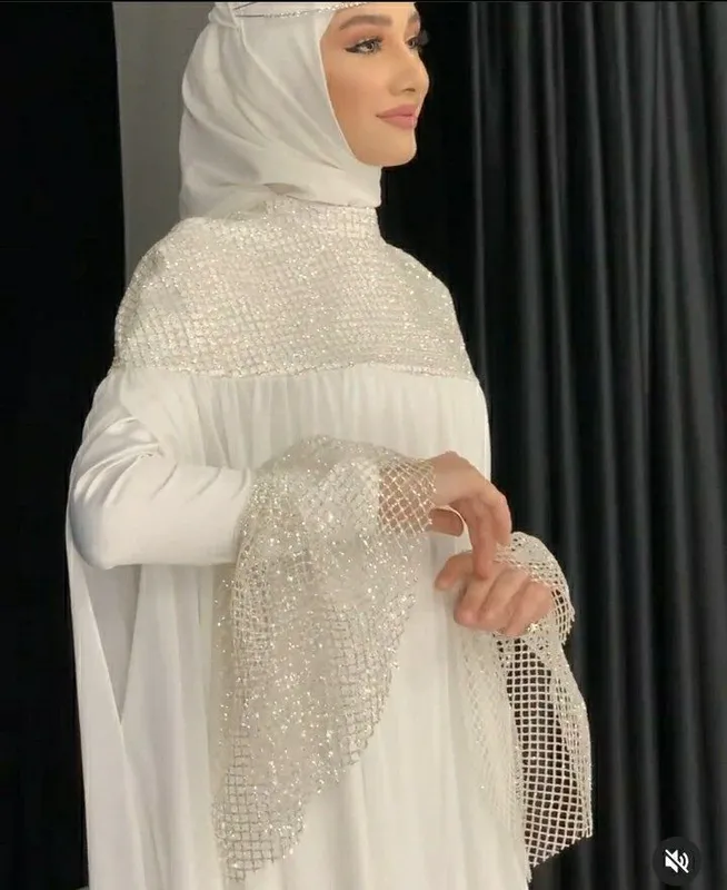 Oq kelin ko'ylak abaya shaklida 1 Oq kelin ko'ylak abaya shaklida 1