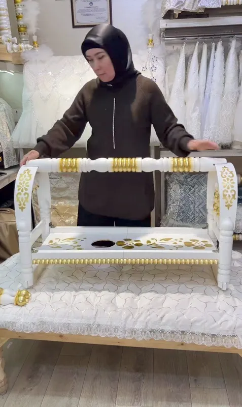 Beshik yigʻiladigan sumkali yengi