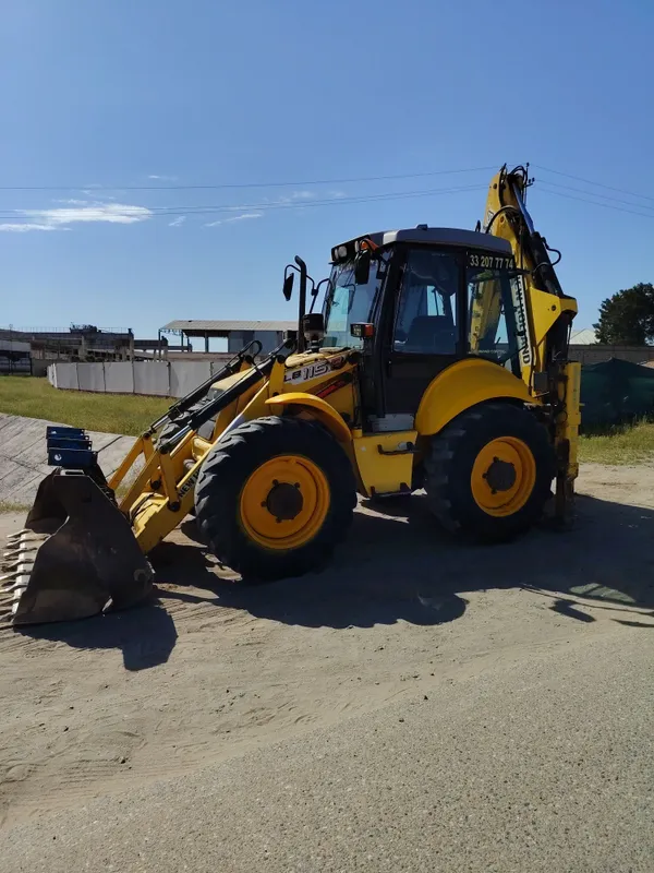 New Holland 115 Pagruzchik 1 New Holland 115 Pagruzchik 1