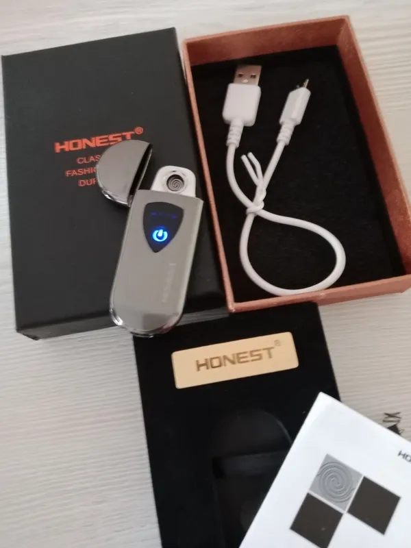 Продам оригинальную зажигалку Honest с электронной зарядкой в отличном