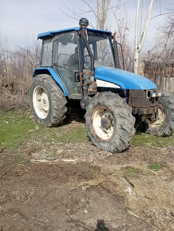 New Holland ТЛ100