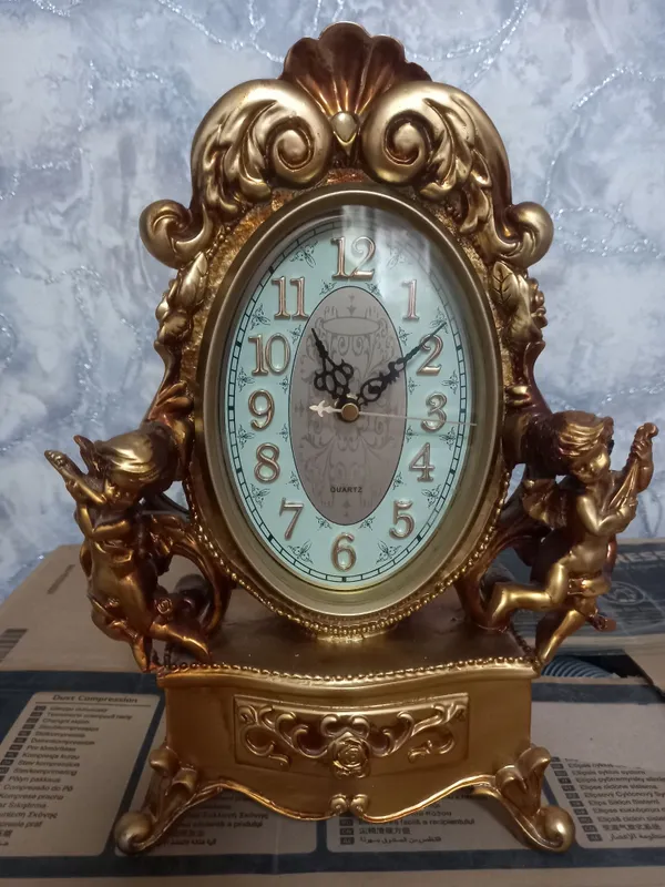 Каминные часы с ангелочками.