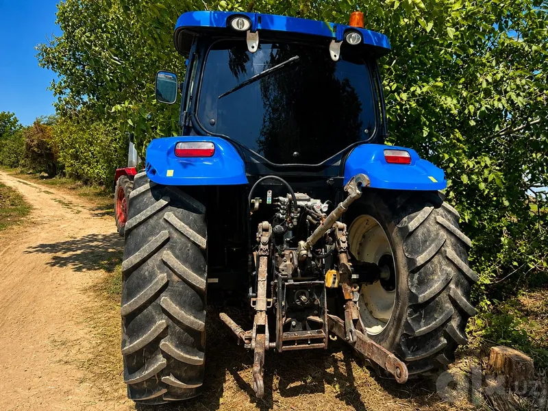 Traktor "New Holland T6070 + 4 korpusli Sukov plugi bilan 4 Traktor "New Holland T6070 + 4 korpusli Sukov plugi bilan 4