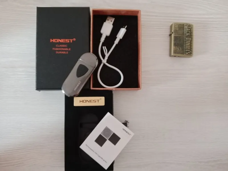 Продам оригинальную зажигалку Honest с электронной зарядкой в отличном — фото 1