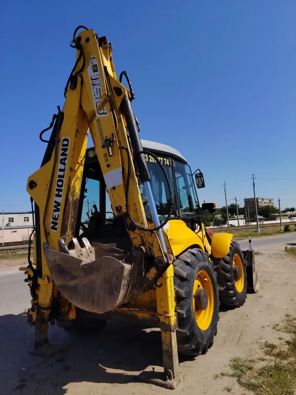 New Holland 115 Pagruzchik 2 New Holland 115 Pagruzchik 2