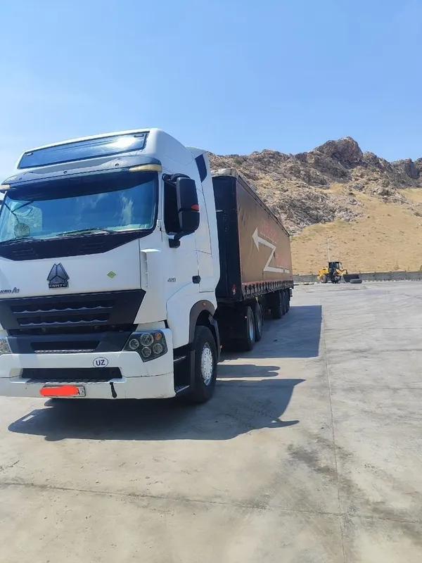 HOWO A7 + SCHMITZ прицеп Сотилади