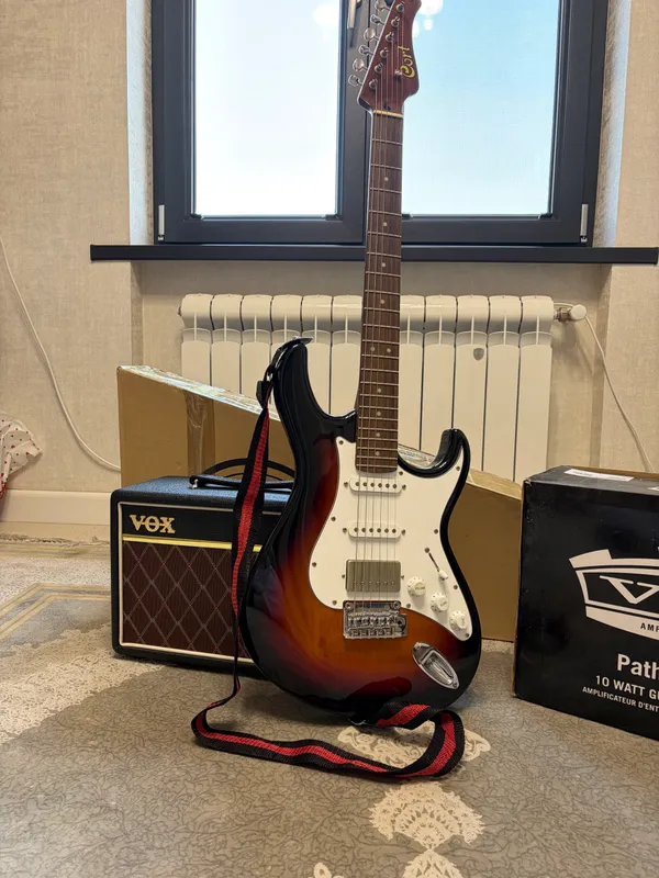 VOX kombo kuchaytirgichi bilan Cort elektro gitarasi 1 VOX kombo kuchaytirgichi bilan Cort elektro gitarasi 1